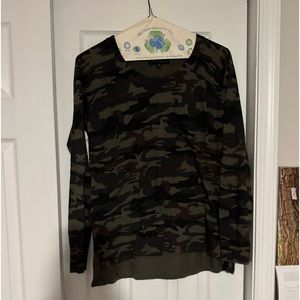 A light camo colored sweater.